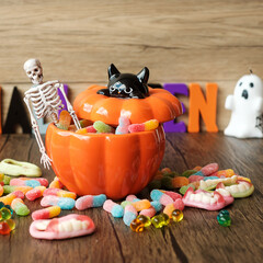Happy Halloween day with ghost candies, candle, pumpkin, Jack O lantern and decorative (selective focus). Trick or Threat, Hello October, fall autumn, Festive, party and holiday concept