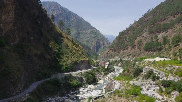 Drone Shot of a small road and river in Himachal Pradesh near Manali, Kasol