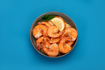 Shrimps on color background.