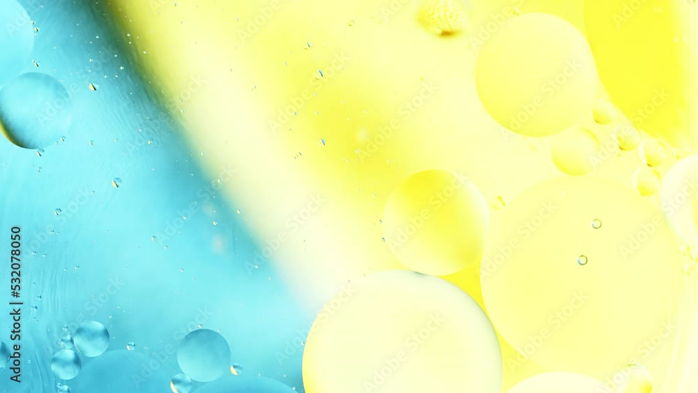 Poster real close up oil bubbles in water rotation with color gradient abstract mixing background.
