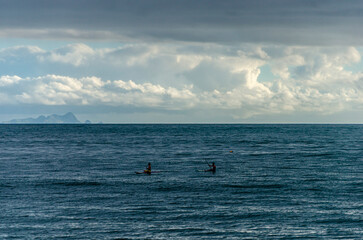 Two people at the sea on the kayak