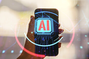 Double exposure of creative artificial Intelligence abbreviation and hand with cellphone on background. Future technology and AI concept