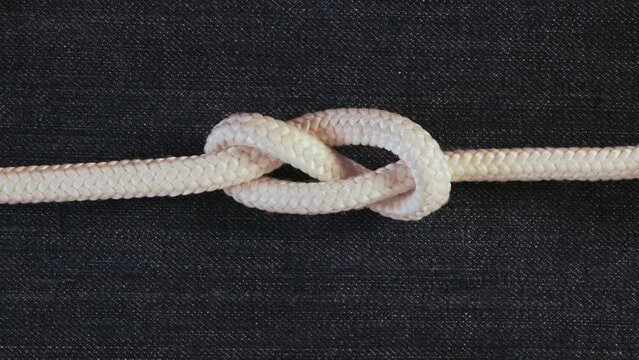 Make a knot with white rope