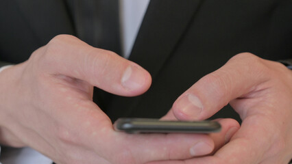 Close up of Middle Aged Businessman using Smartphone, Mobile