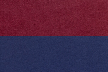 Texture of craft navy blue and dark red paper background, half two colors, macro. Vintage dense...