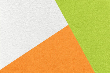 Fototapeta premium Texture of craft white, green and orange shade color paper background, macro. Structure of vintage abstract cardboard