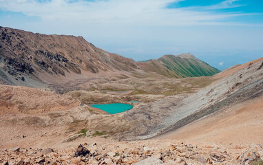 Awesome aerial view to turquoise lake in mountain valley. Beauty of nature.