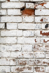 old brick wall painted with white paint