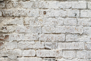 old brick wall painted with white paint