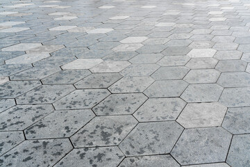 The texture of hexagonal tiled pavement with perspective.