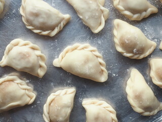 Top view raw small spiral curry puff