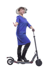 Full length profile shot of an woman with a scooter isolated on white background