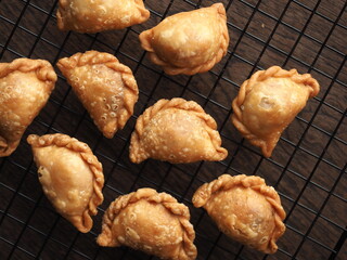 top view golden brown deep fried mini curry puff