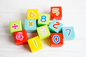 Number wood block cubes for learning Mathematic, education math concept.