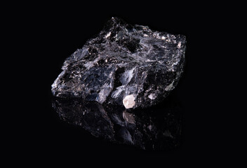 Black mineral galena with a rough surface