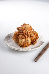 Udang Rambutan or chinese fried dumpling from shrimp ball coated with shraded dumpling skin then deep fried.