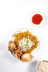 Mie Goreng ala Mie Gacoan is homemade fried noodle topping with chicken shraded and fried dumpling.