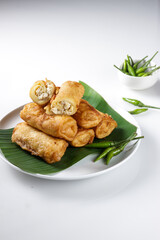 Sosis Solo is Indonesian traditional fried egg crepe with sweet and minced chicken filling.