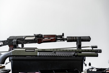 Automatic rifle on stand on the table of the weapons workshop.