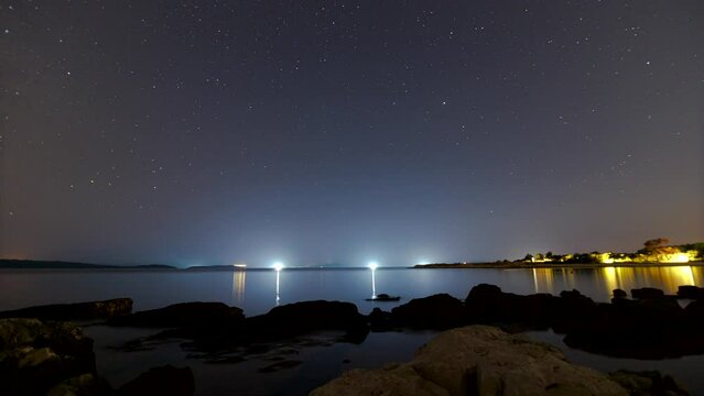 Time lapse shot of dusk to night with stars and milky way over Dugi Otok in Suha Uvala bay on Uglijan