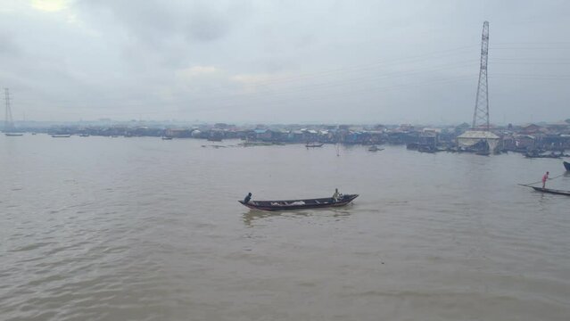 Fisher men inside their canoe trying to fish in Makoko, Lagos