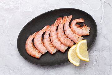 Shrimps on plate with lemon