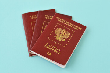 The foreign passport of the Russian Federation on blue backgound. The concept of imposing sanctions...