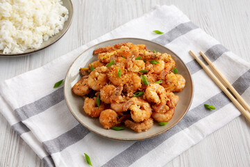 Homemade Crispy Salt and Pepper Shrimp with Scallions on a Plate, side view.