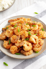 Homemade Crispy Salt and Pepper Shrimp with Scallions on a Plate, side view.