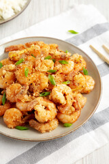Homemade Crispy Salt and Pepper Shrimp with Scallions on a Plate, side view.