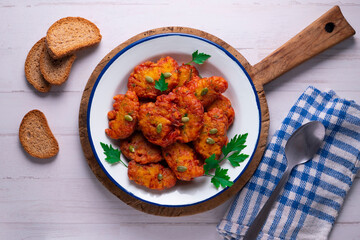Pumpkin fritters typical of Spain. Traditional recipe made with egg and pumpkin.