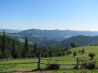 Fototapeta na wymiar landscape with a fence and mountains