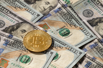 Money equivalence between bitcoin and dollars. Exchange cryptos. Pile of 100 dollar banknotes