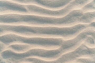 Wavy nature sand background. Yellow desert sand texture. Nature beige dune backdrop. Overlay...