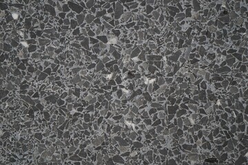 Fototapeta na wymiar Grunge small dolomite crushed stone texture. Natural grey, white and black colors stone background. High resolution seamless stone backdrop. Copy space for design and text.