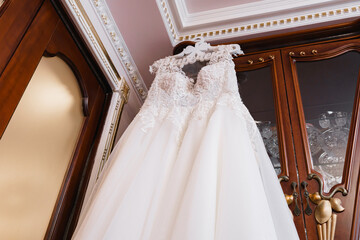 wedding dress on a hanger