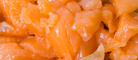 Appetizing pieces of red fish lightly salted salmon close-up macro.