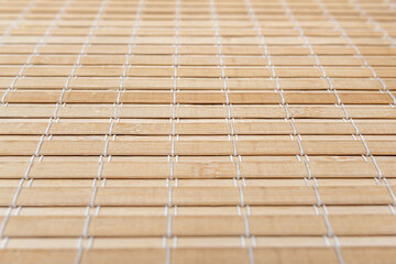 Bamboo wooden tablecloth for decor in the kitchen. The pattern is clearly visible.