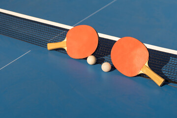 Ping pong table, rackets and balls