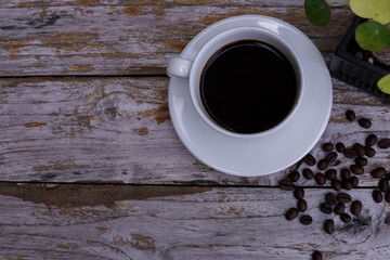 hot americano coffee on old wooden table.