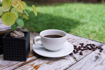 hot americano coffee on old wooden table.