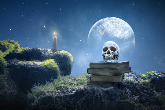 Pile of the book with a human head skull