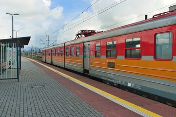 Fototapeta na wymiar red electric train in the station