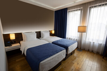 Interior of a double bed hotel bedroom in the morning