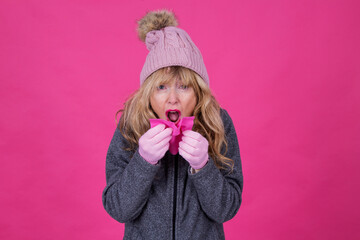 woman with handkerchief over her nose sneezing