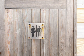 male and female symbol on a rustic wooden background