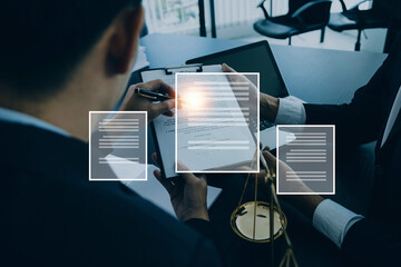 Justice and law concept.Male judge in a courtroom with the gavel, working with, computer and docking keyboard, eyeglasses, on table in morning light