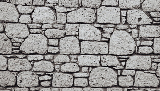 Ancient Wall. Worn Stone laying Old Brickwork Construction Textured Wallpaper Web Banner Monochrome