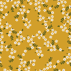 Simple vintage pattern. small white flowers. green leaves. yellow background. Fashionable print for textiles and wallpaper.