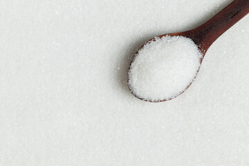 White sugar background. Top view, close-up.